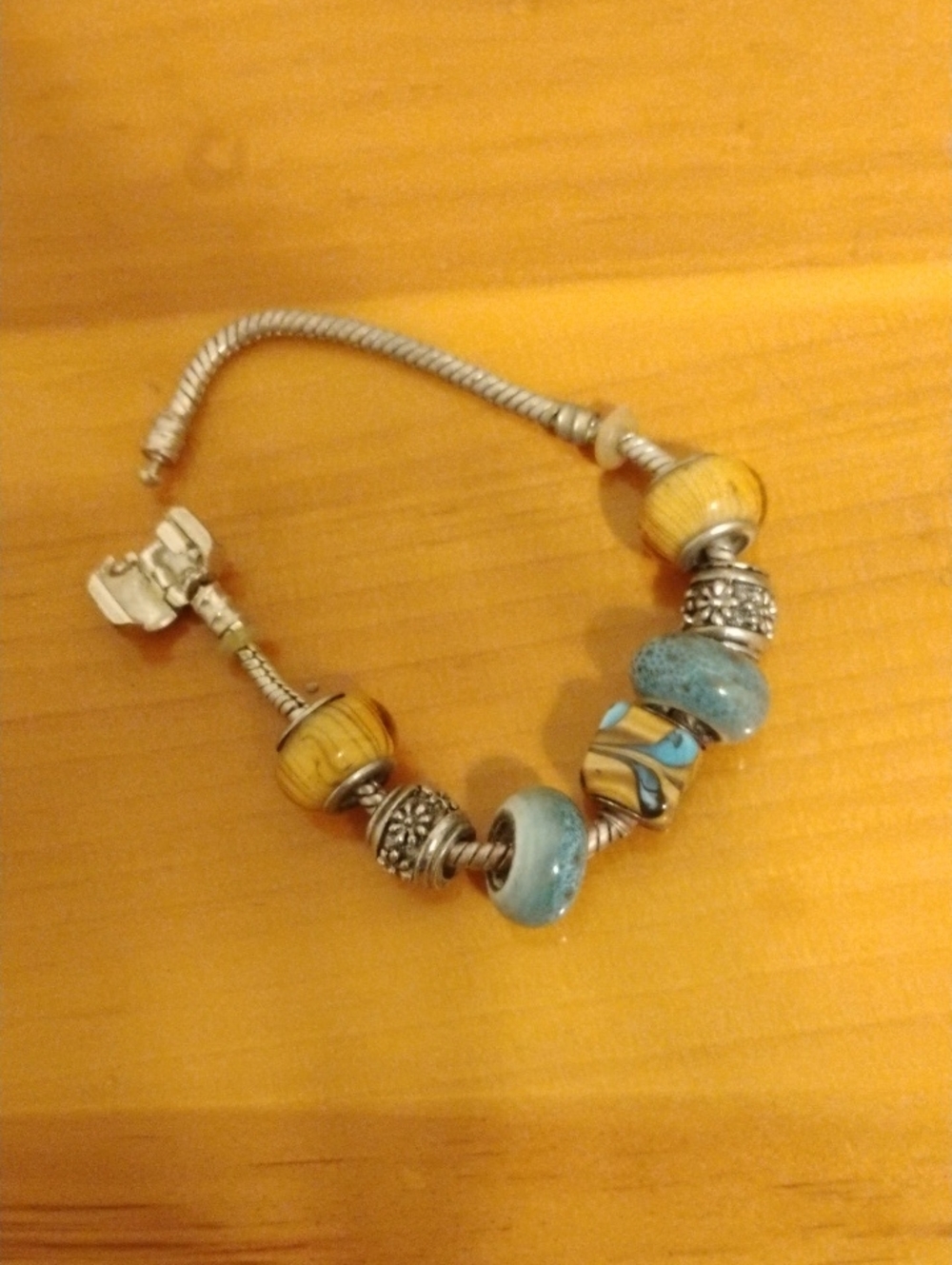 Silver Charm Bracelet with Blue and Yellow Glass Beads